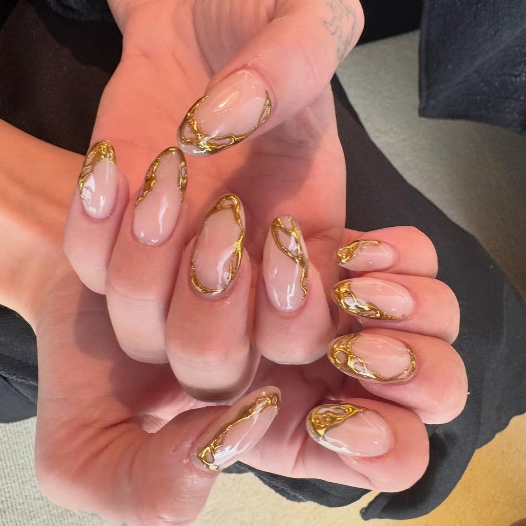 stylish manicured nails with golden accents