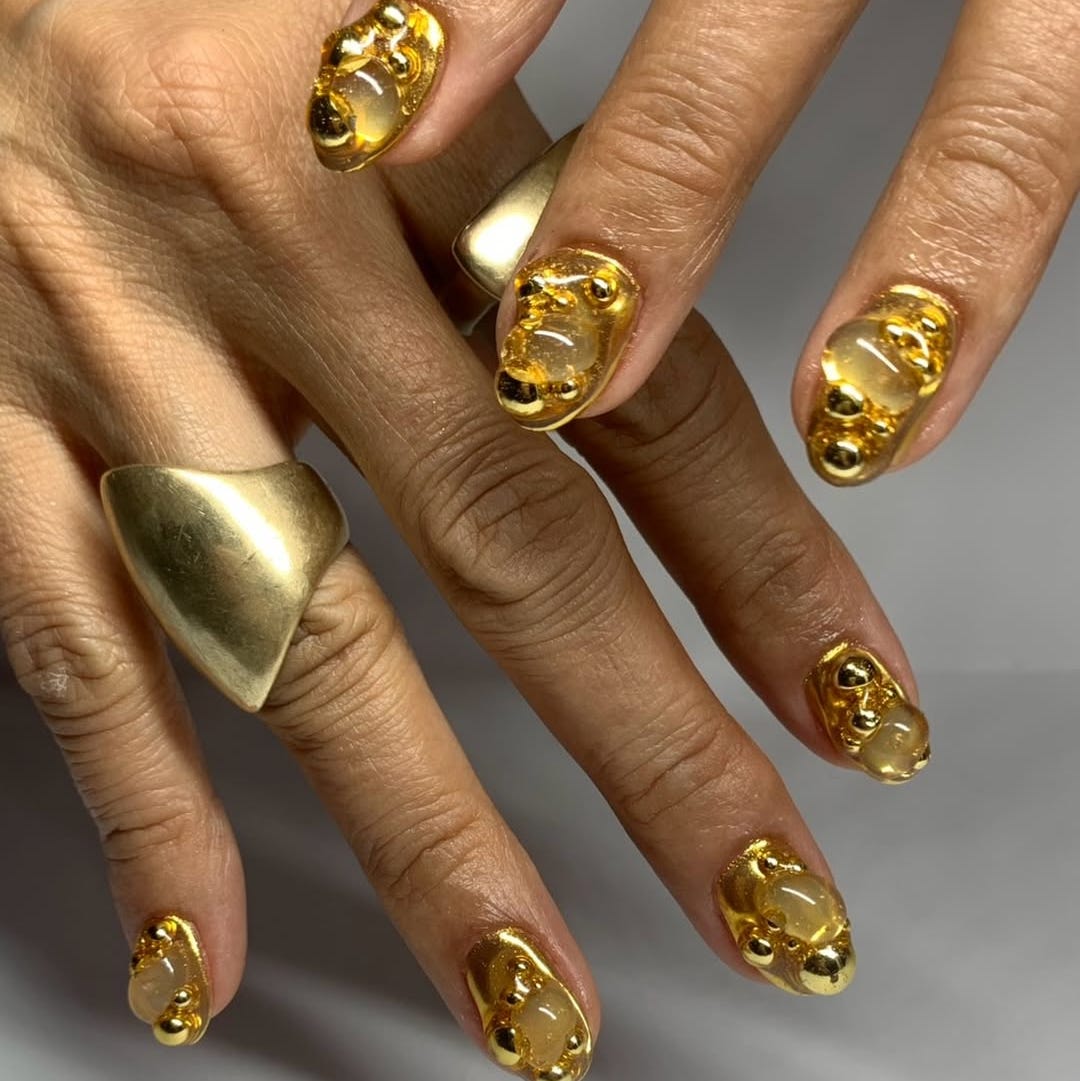 decorative nails with gold elements and unique designs