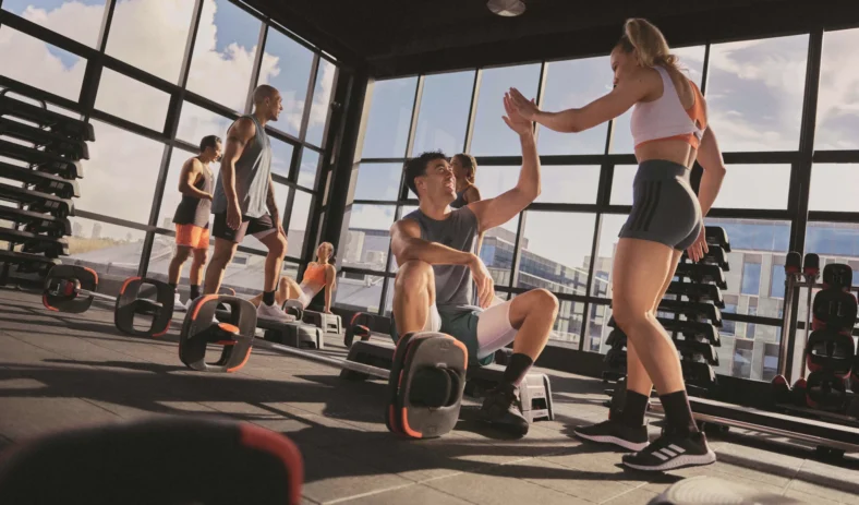 people high five each other after a workout