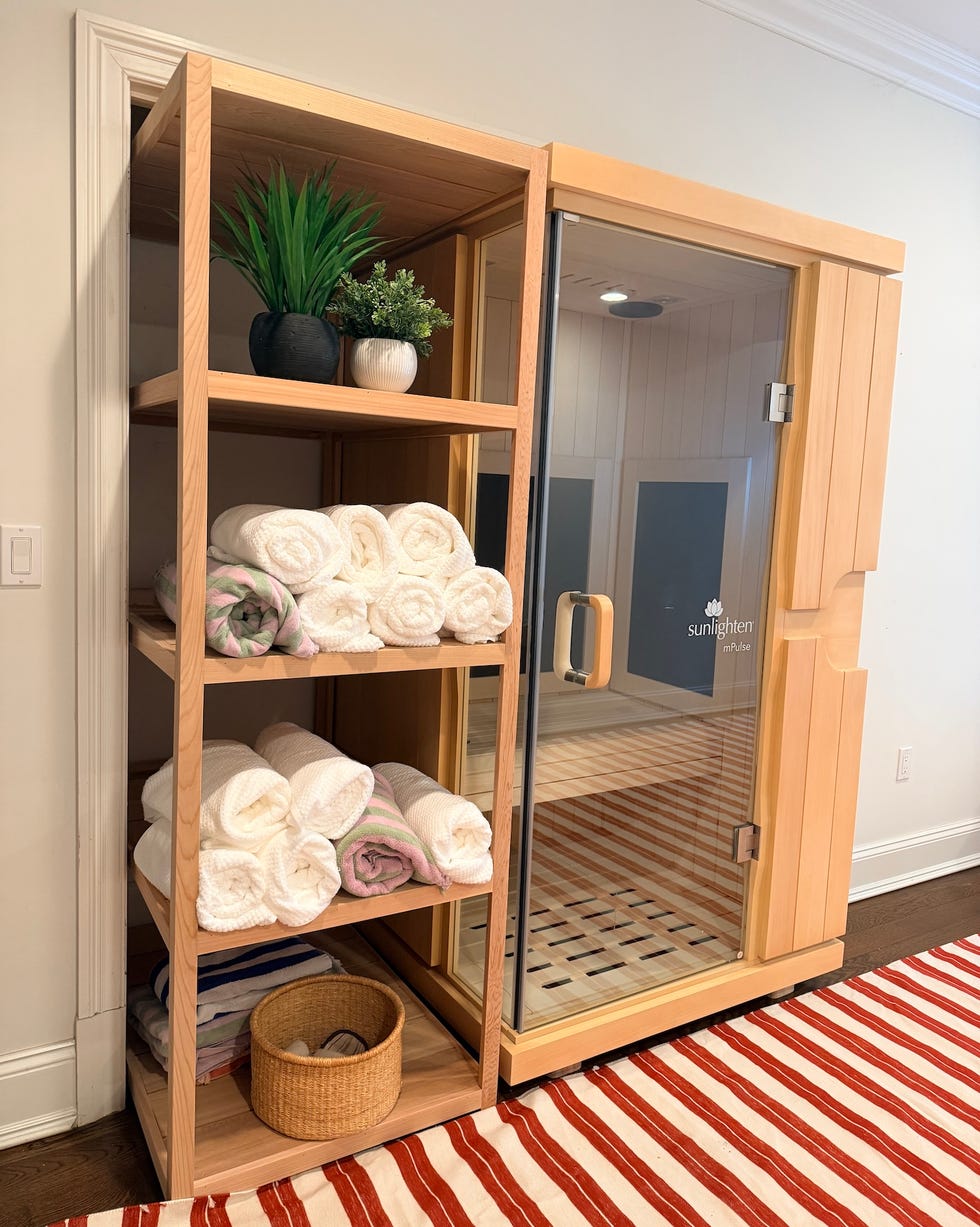 infrared sauna with shelving for towels and plants