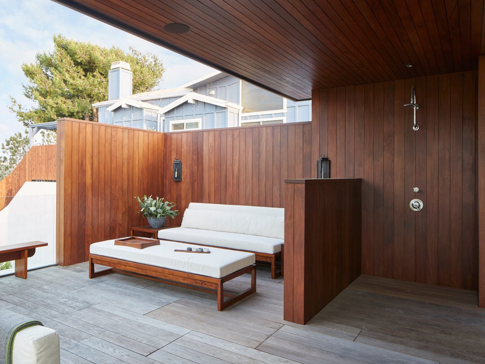modern outdoor seating area with wooden walls and furnishings