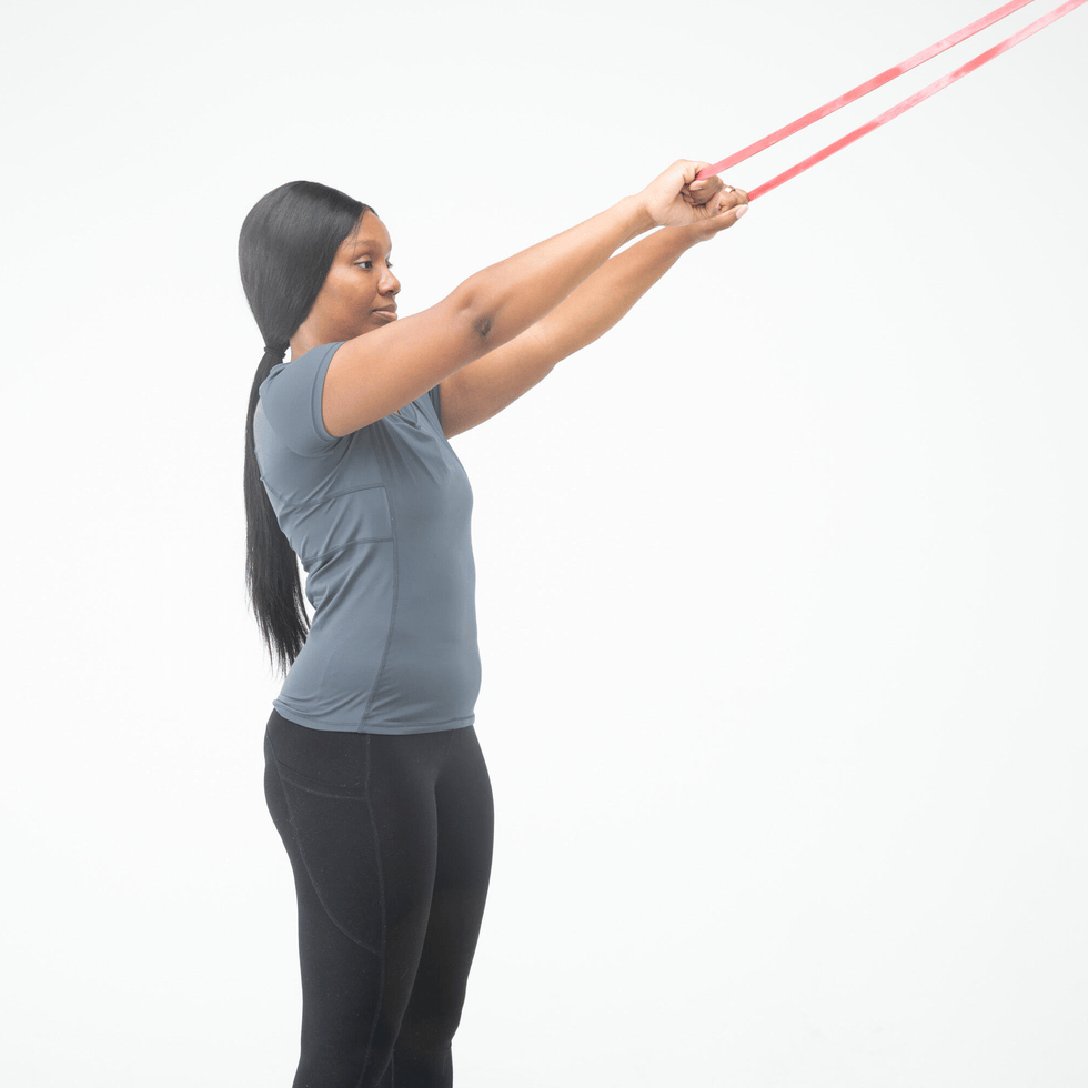 person performing an exercise with resistance bands