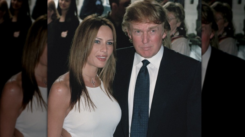 Melania Knauss in white with Donald Trump at an event