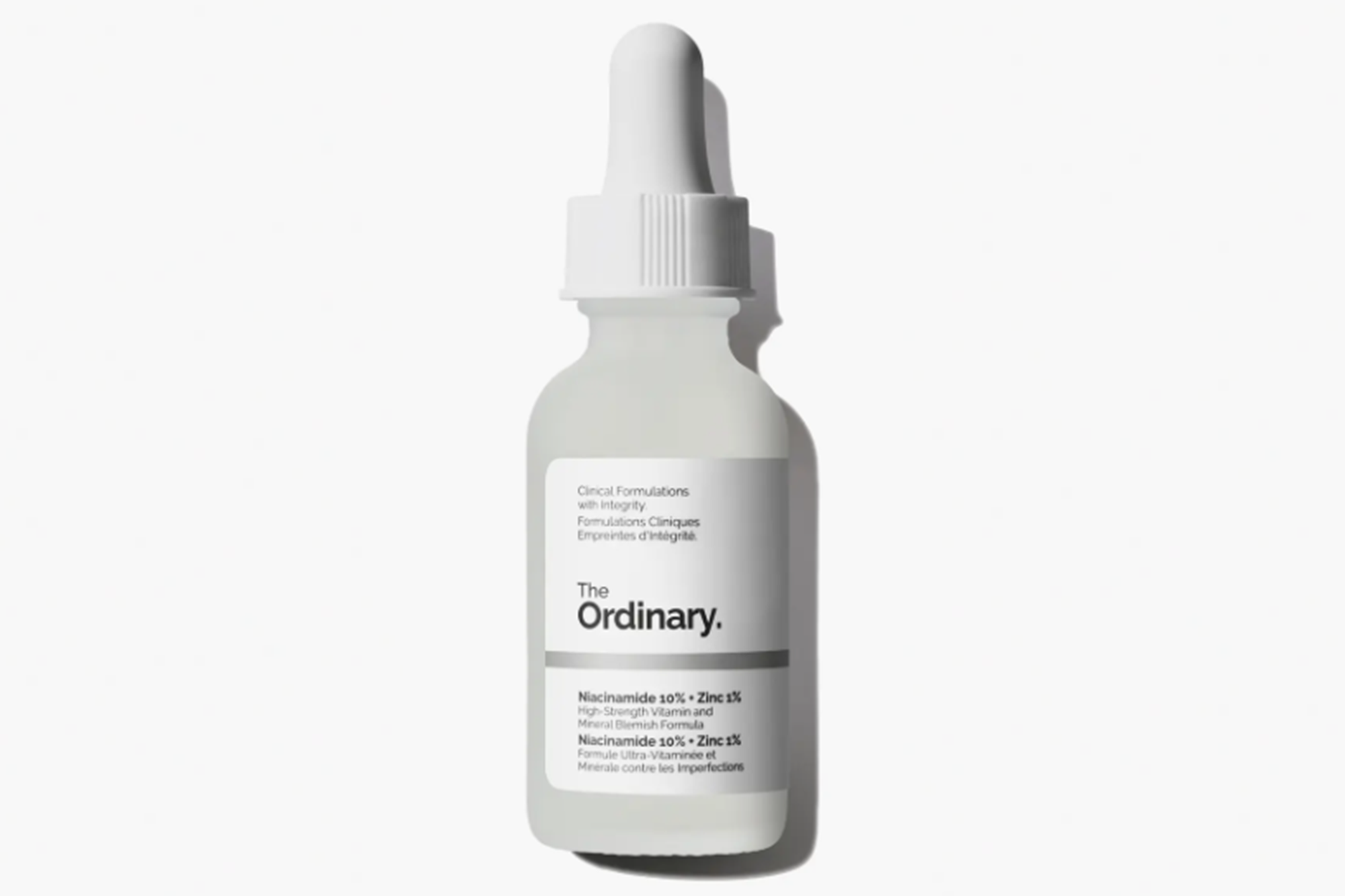 A bottle of The Ordinary Niacinamide 10% + Zinc 1% serum with a white dropper.