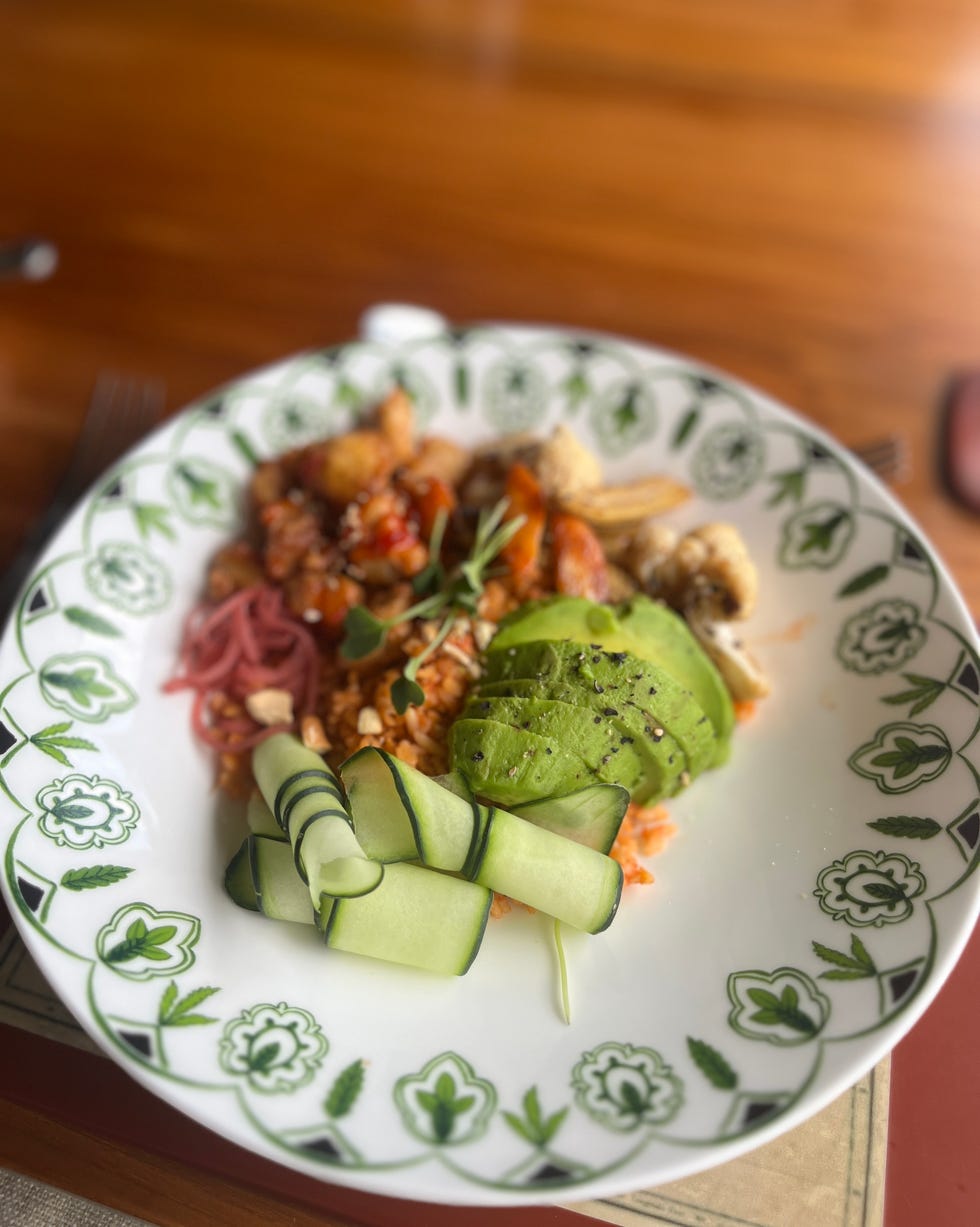 plate of food with various ingredients including avocado and cucumber paradise plains kenya