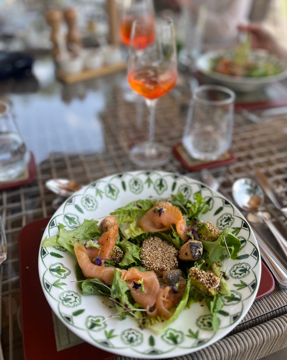 salad with salmon and sesame seeds on a decorative plate paradise plains kenya