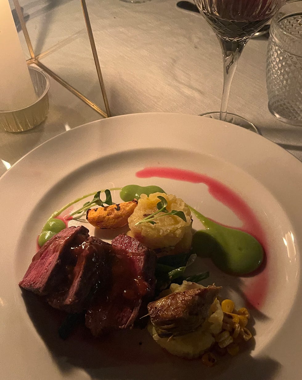 a plated gourmet meal featuring meat vegetables and sauce paradise plains kenya