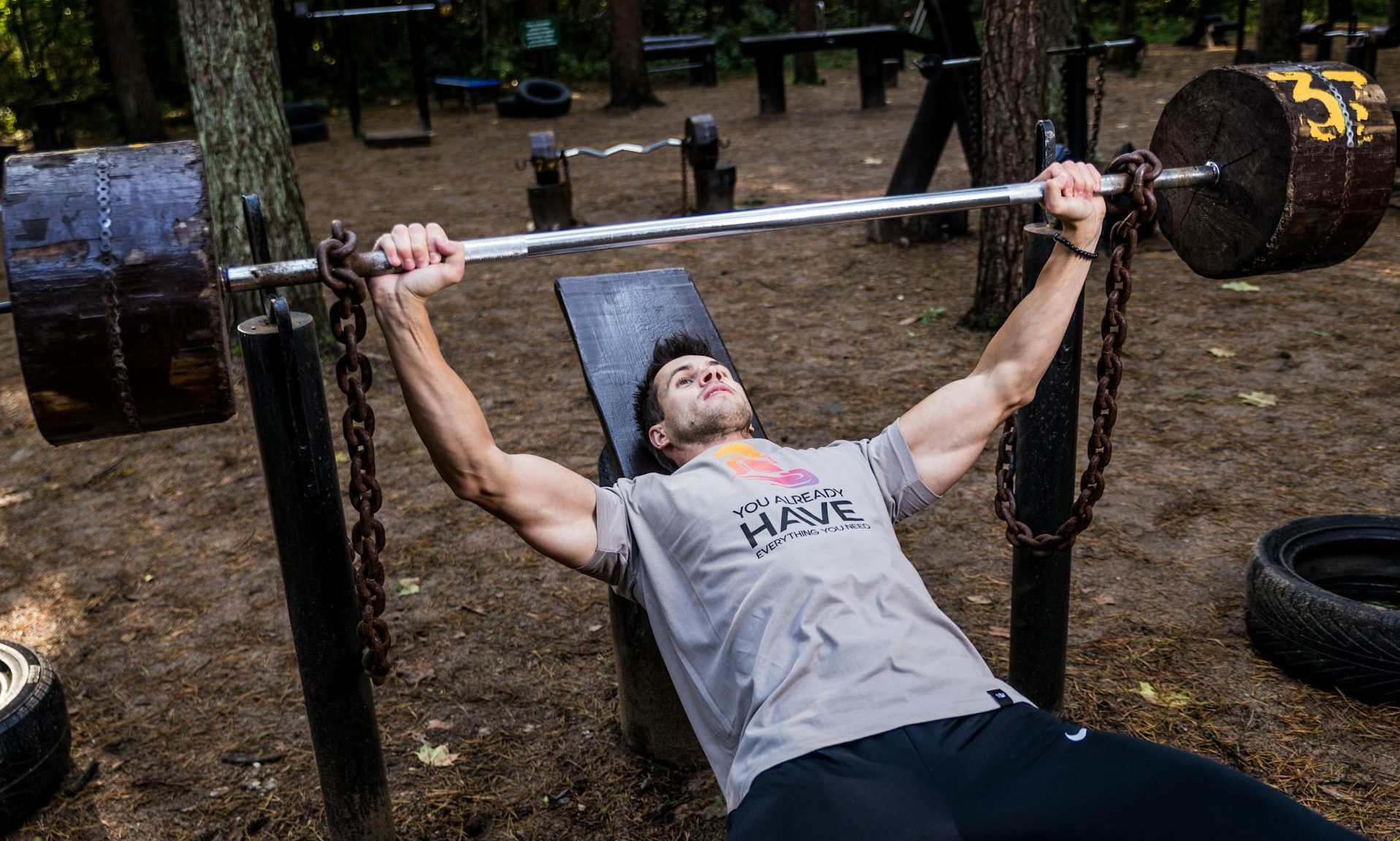 man doing bench press barbell weightlifting
