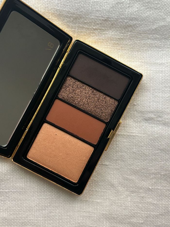 A Victoria Beckham brown eyeshadow palette on a white background