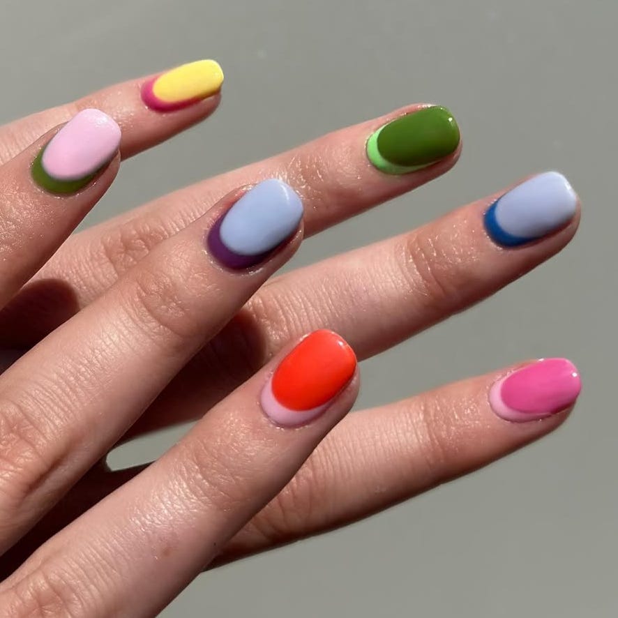 colorful nail art featuring various designs on different nails
