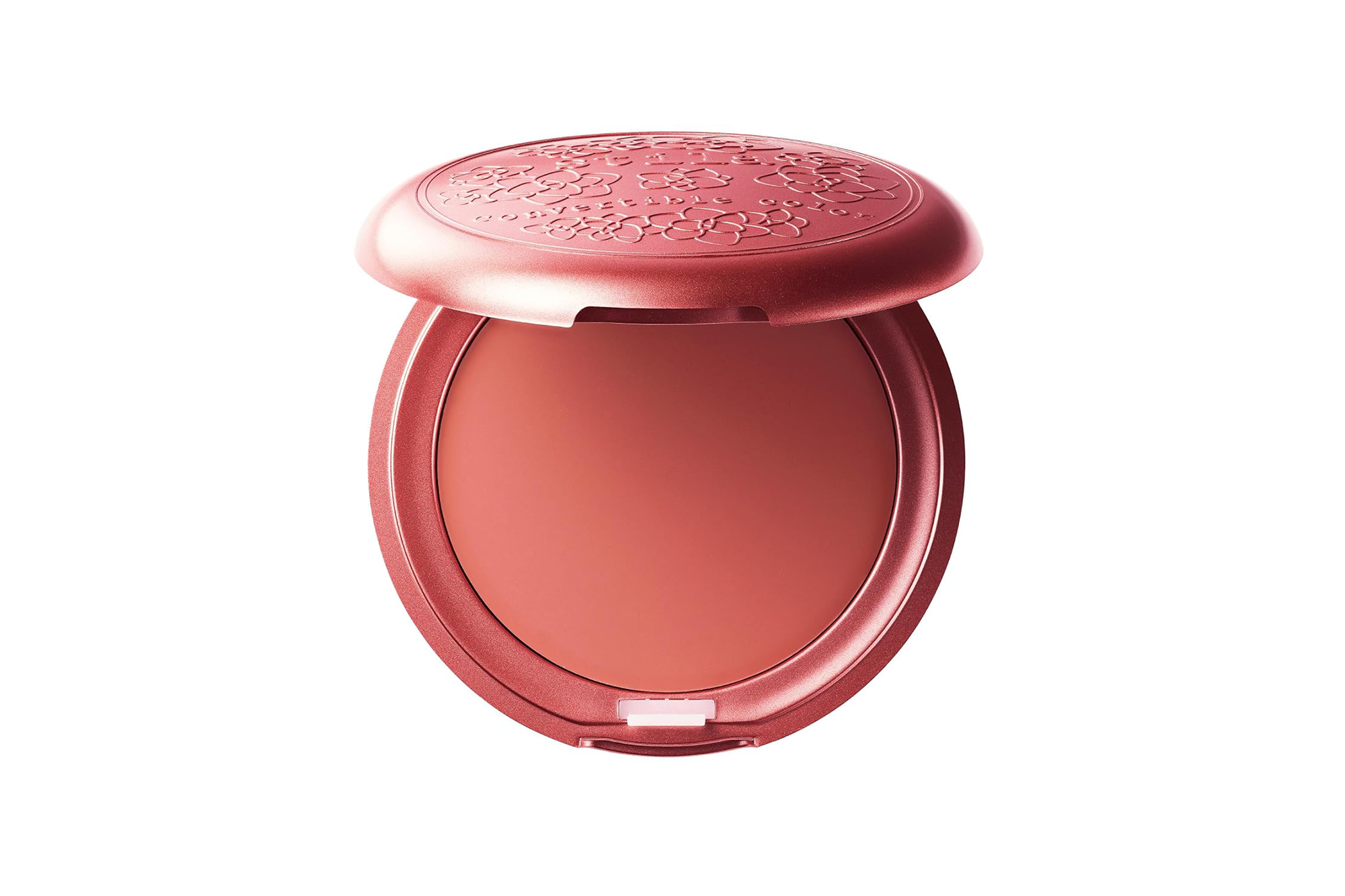 Opened coral cream blush compact with a floral design on the lid.