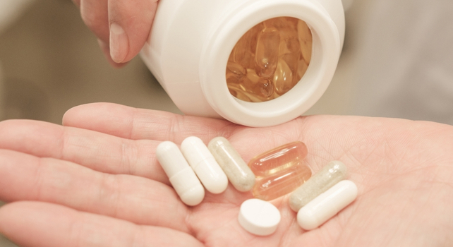 pills in a person's hand