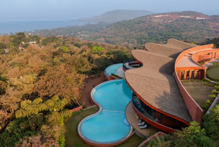 Coastal wellness complex built into hillside