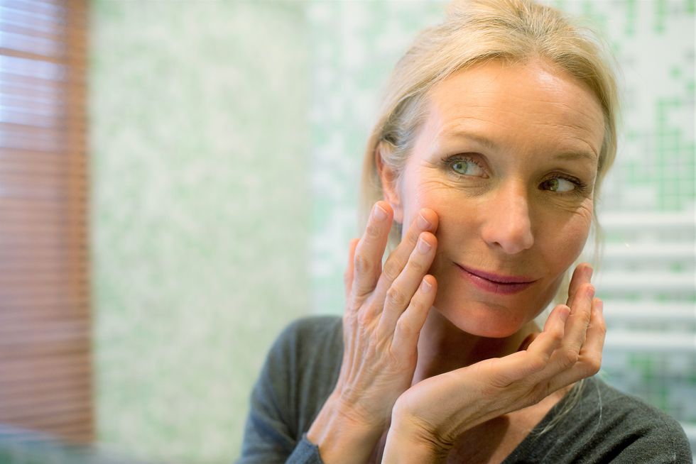 Woman applying skin care