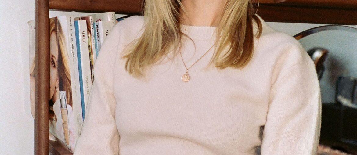 Image may contain Blonde Hair Person Adult Accessories Face Head and Furniture