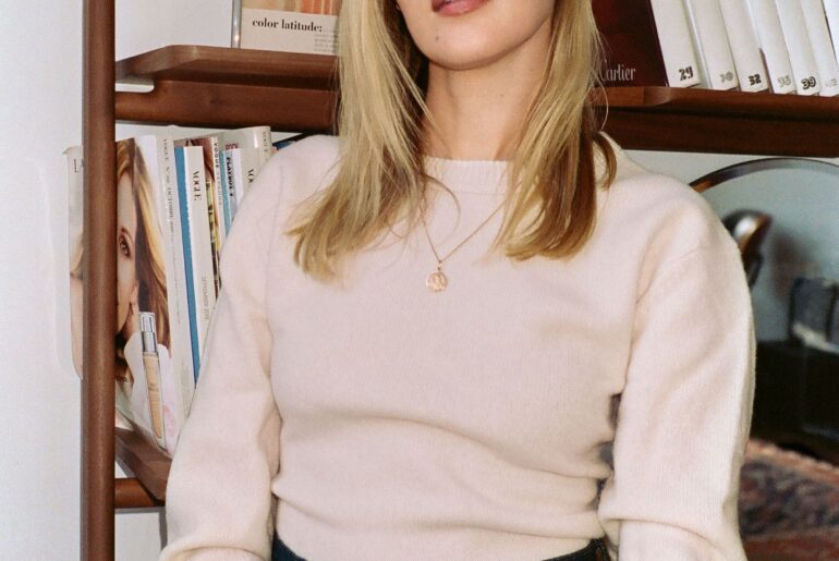 Image may contain Blonde Hair Person Adult Accessories Face Head and Furniture