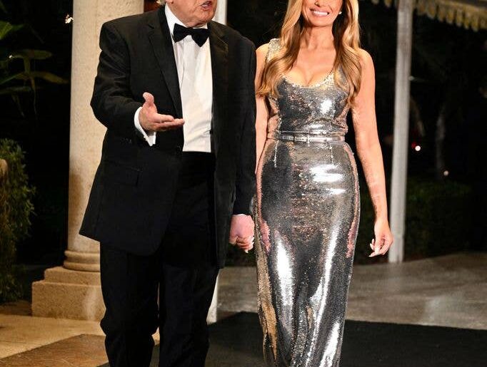 US President Donald Trump and First Lady Melania Trump attend the New Year's Eve Party at his Mar-a-Lago residence in Palm Beach, Florida