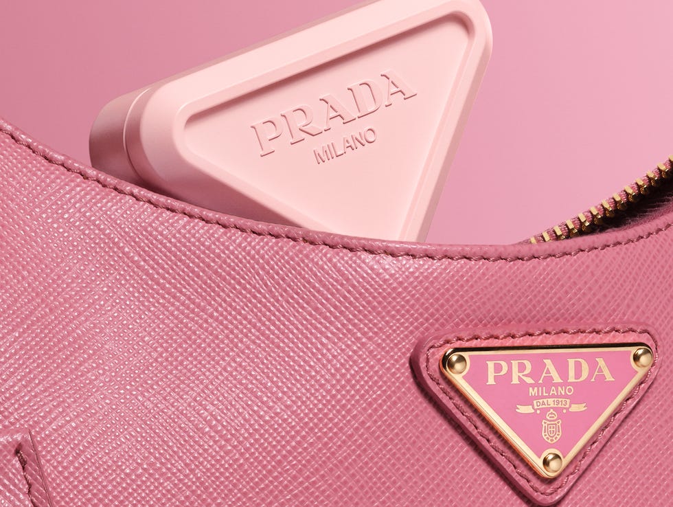 pink prada handbag with a triangular case visible inside