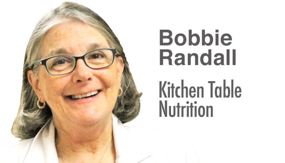 Bobbie Randall smiling in a professional setting.