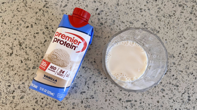 Vanilla bottle and a glass cup