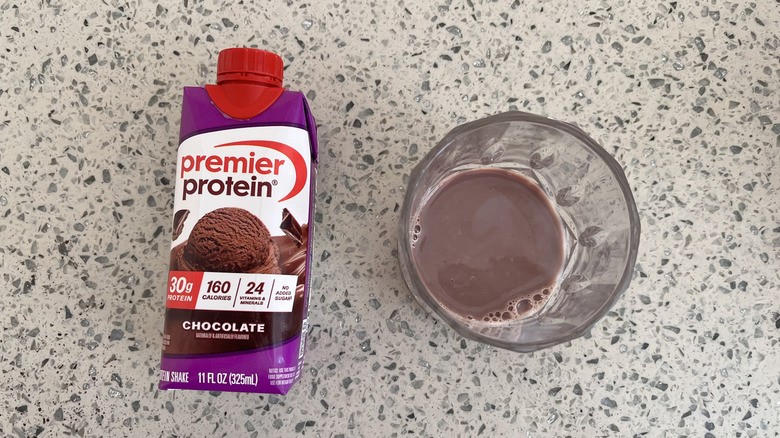 Chocolate bottle and a glass cup