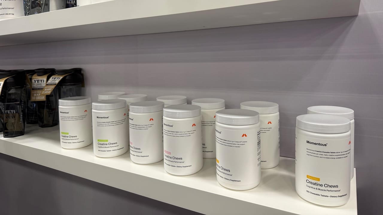 Momentous creatine chews dietary supplement bottles at Arnold Expo
