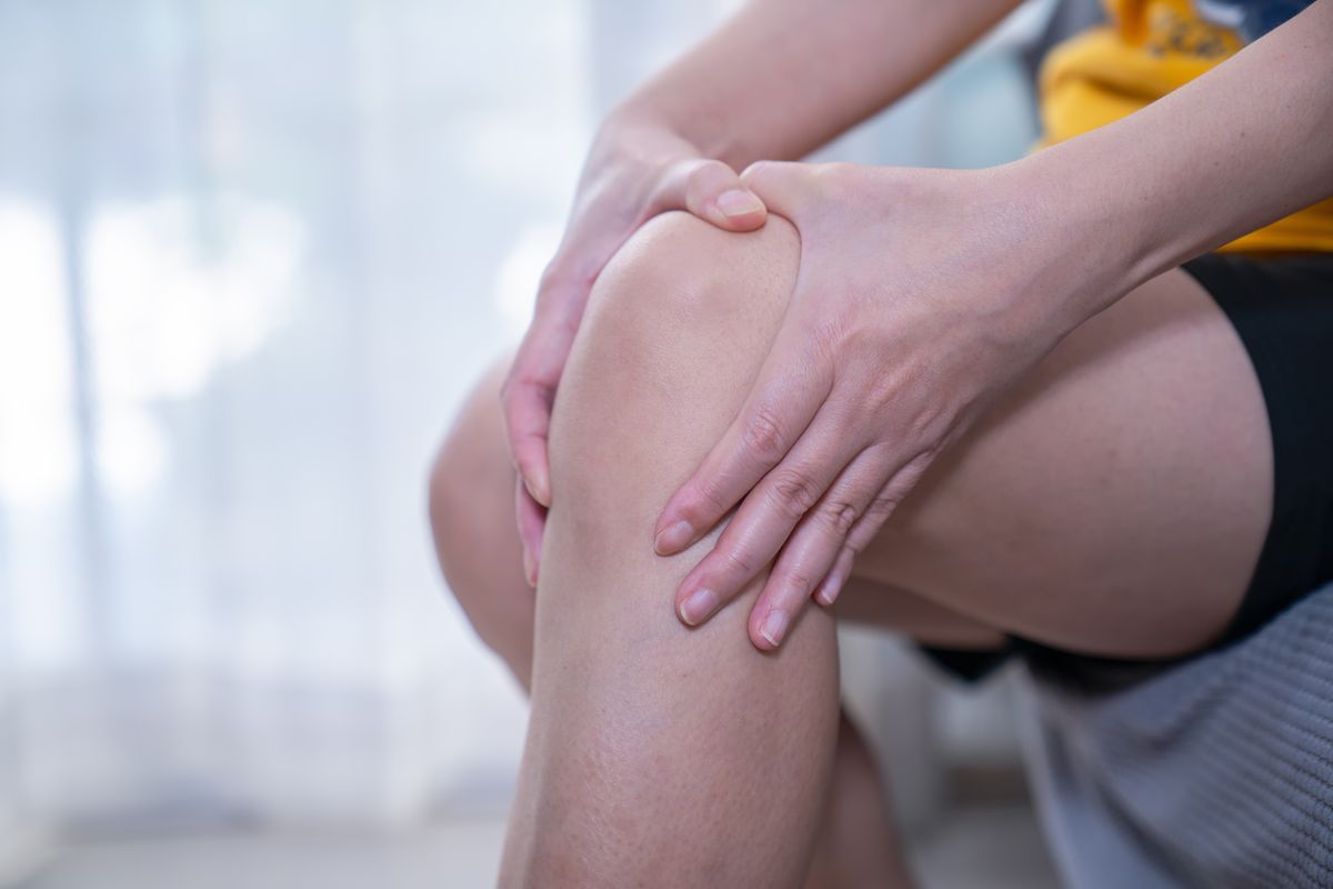 Woman has knee pain.