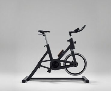 A sleek, modern Peloton exercise bike placed elegantly on a clean, monochromatic background, using dramatic studio lighting and shadows to symbolize the company