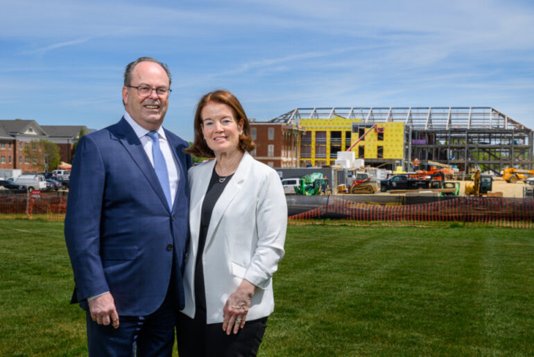 (PHOTO: Bill and Tish Slattery near the HealthEU construction site on the Elon University campus on April 9, 2026. Contributed.)