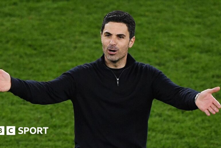 Mikel Arteta with his arms outstretched