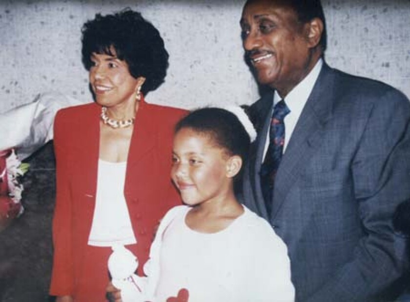 Alexa Rice (center) with grandparents Eunice Johnson and John H. Johnson. 