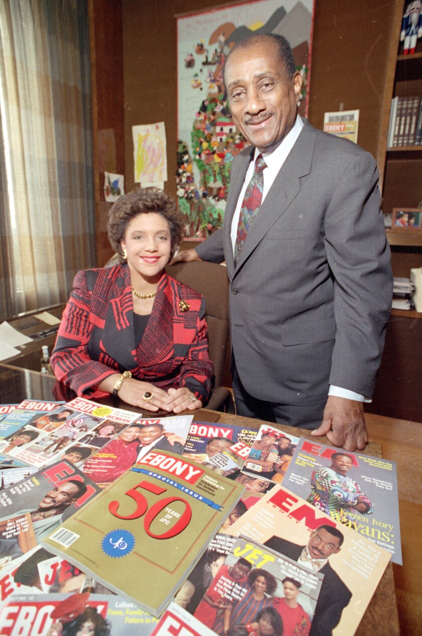 John H. Johnson, chairman and C.E.O. of Johnson Publishing Co., poses with his daughter Linda Johnson Rice, who is president of the company, at the headquarters in Chicago, Ill., in Nov. 1992. The firm, which publishes Ebony magazine, is celebrating fifty years in the publishing business.  (AP Photo/Mark Elias)