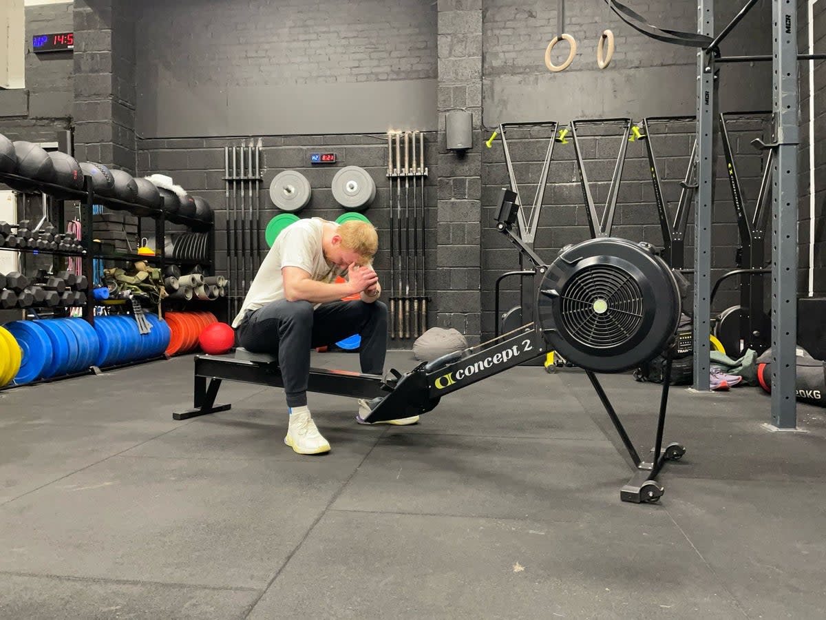 Fitness writer Harry Bullmore after trying Olympic silver medallist and world champion BMX rider Kieran Reilly's go-to rowing machine workout (Harry Bullmore / The Independent)