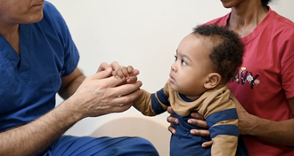 Link to Video: Medical military personnel checking out a baby