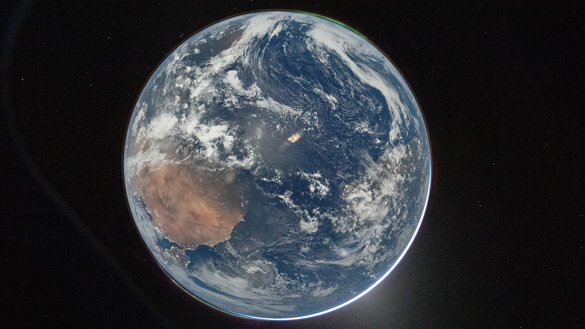 This image provided by NASA shows a view of Earth taken by NASA astronaut and Artemis II Commander Reid Wiseman from of the Orion spacecraft's window after completing the translunar injection burn on April 2, 2026.