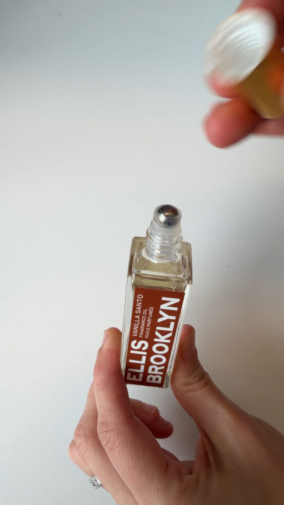 Fragrance oil bottle with rollerball applicator