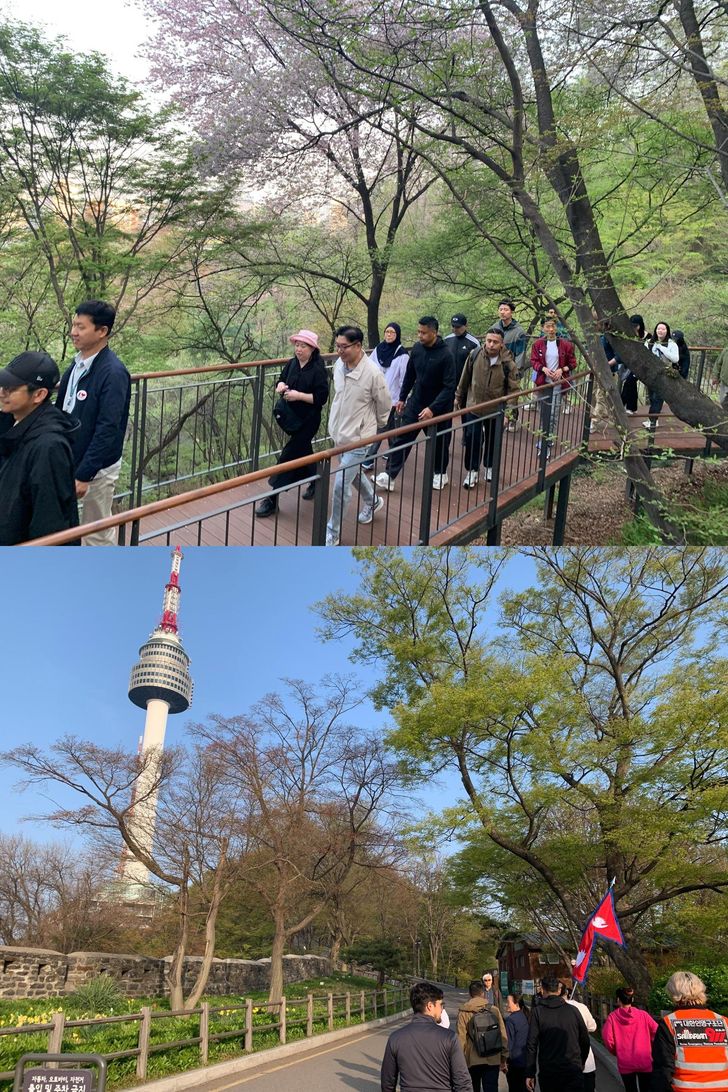 Participants walk during an early-morning  program on Mount Nam in central Seoul, Wednesday, hosted by the Embassy of Nepal in Korea. Korea Times photo by Anna J. Park