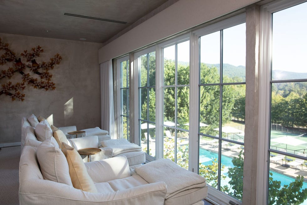 A cozy seating area with a view of outdoor amenities.