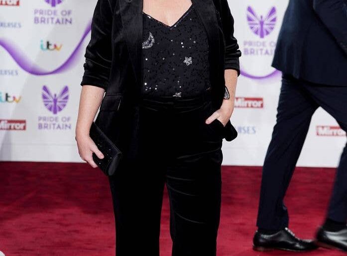 Joanna Page on red carpet in black suit