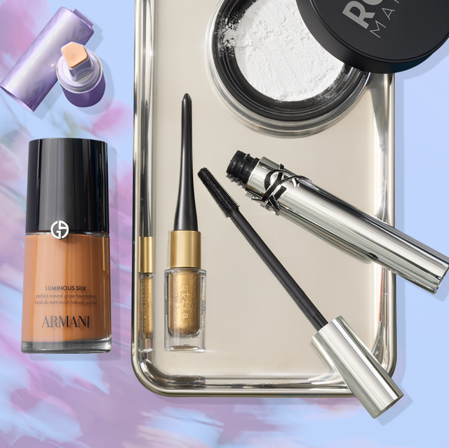 Makeup products arranged on a reflective tray.