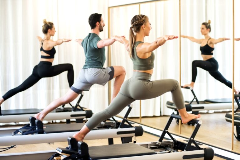 people exercising in a pilates class