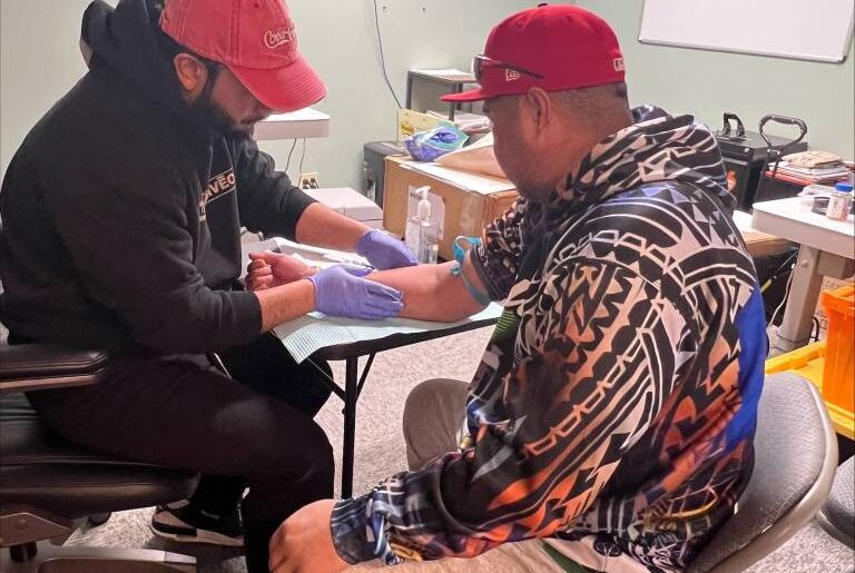 A representative from King County Public Health performs a free TB test at the PICA-WA wellness fair event on March 26 in Federal Way.