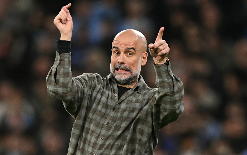 Manchester City's Spanish manager Pep Guardiola gestures on the touchline 