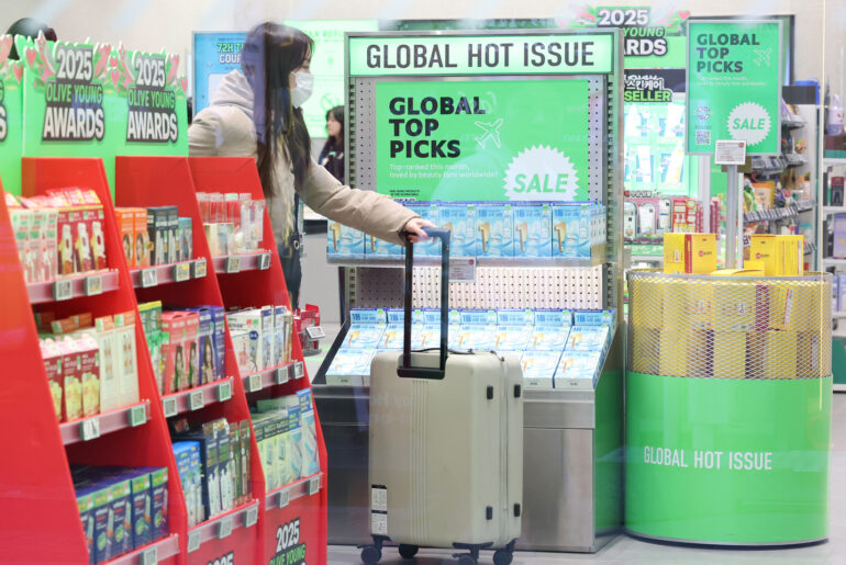 A person shops inside a retail store of cosmetic products in central Seoul in December 2025. [YONHAP]