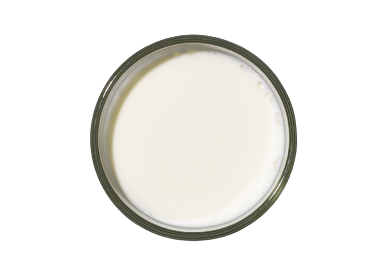 a round glass container filled with white liquid