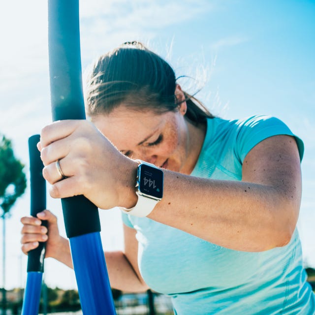 Woman doing cross training on a outdoor stepper.