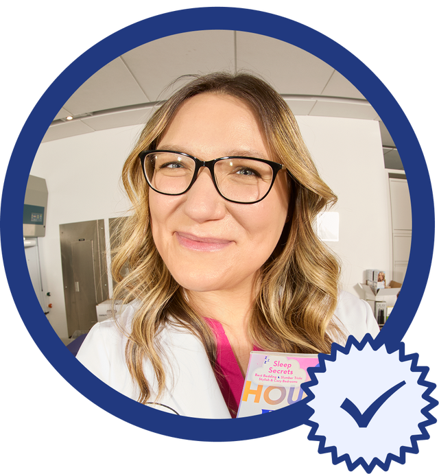 Person holding a magazine in a clinical setting