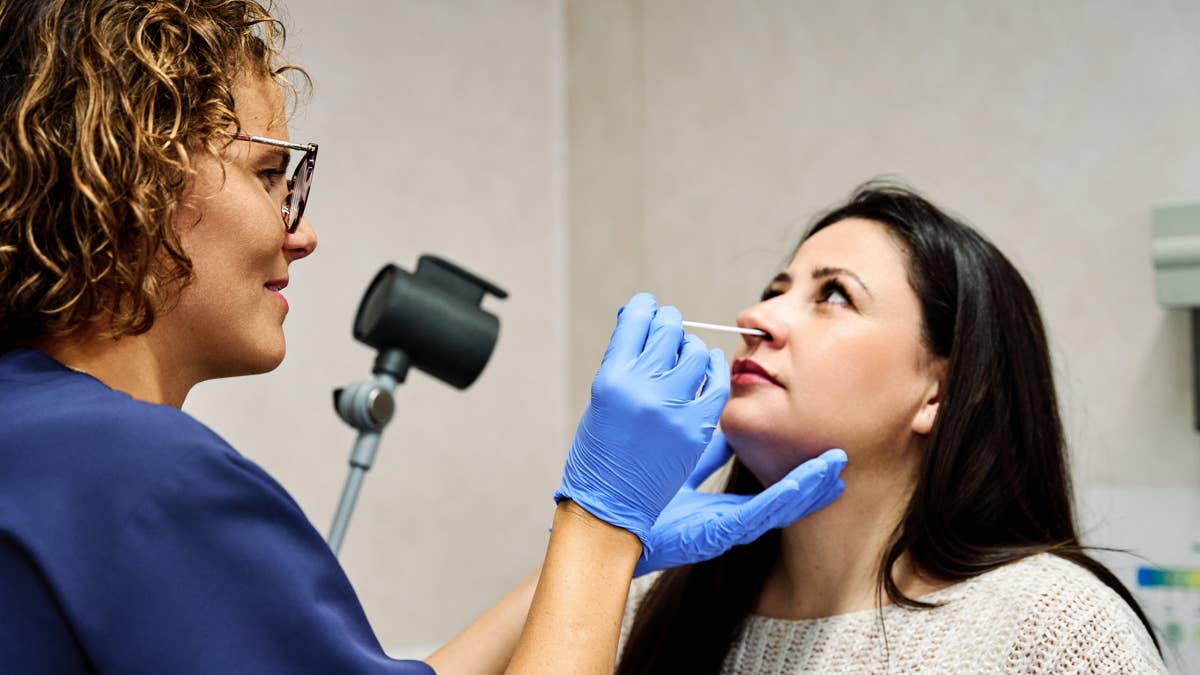 Woman getting COVID test&period;