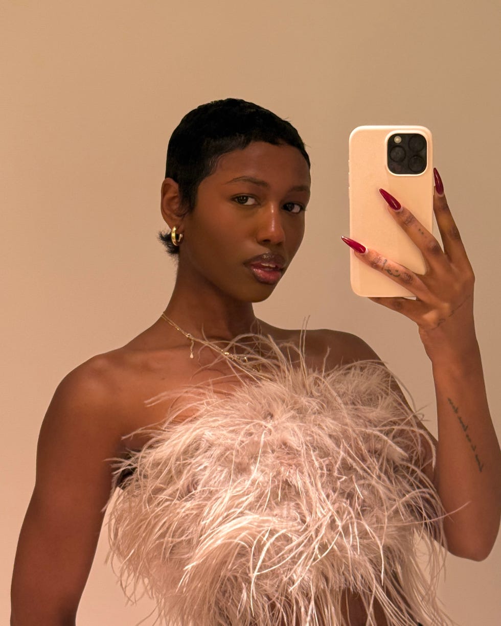 Person taking a mirror selfie.