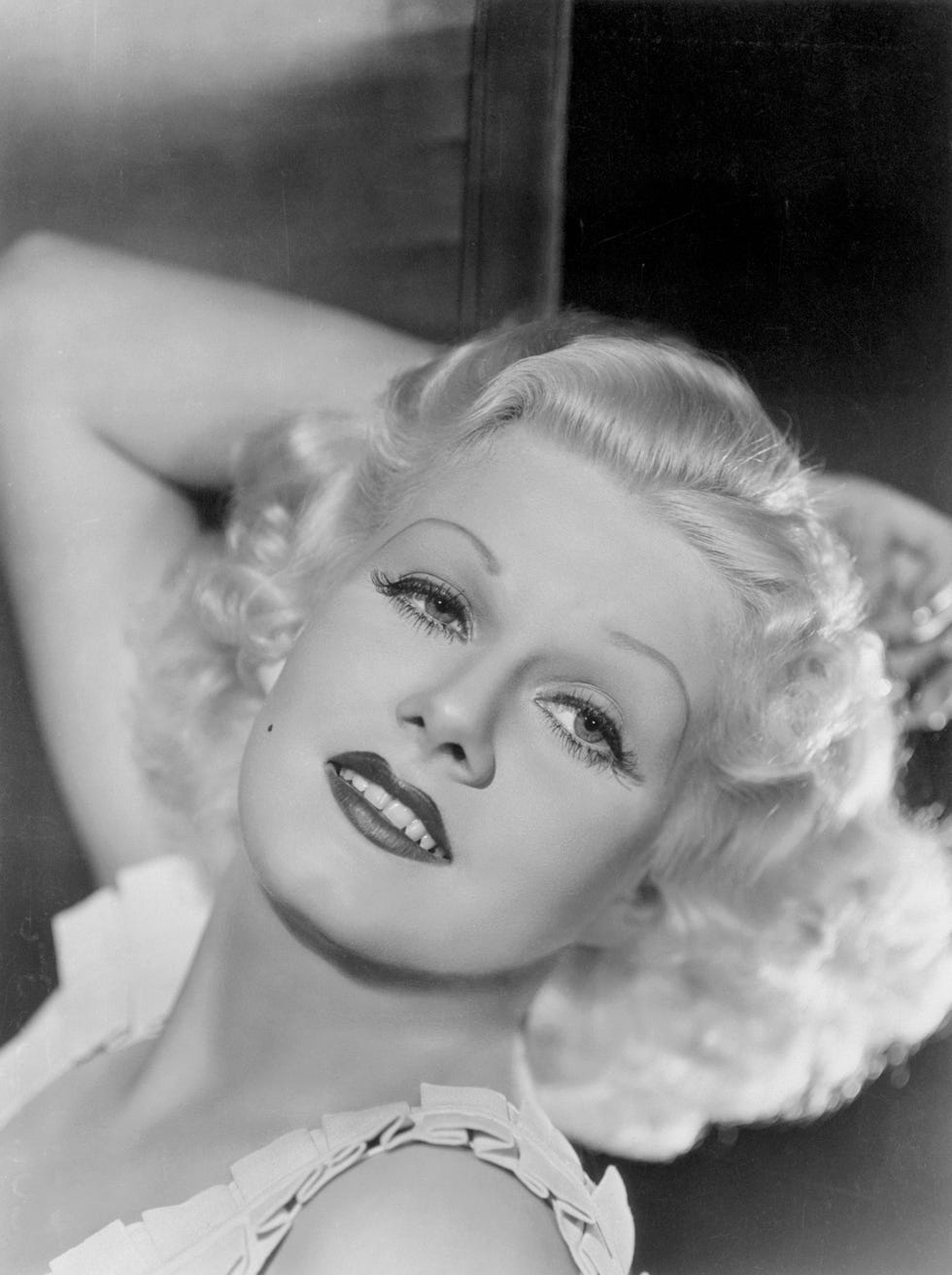(original caption) film favorite. gorgeous jean harlow, platinum haired siren of the screen, photographed in a position that brings out every angle of her classic features.